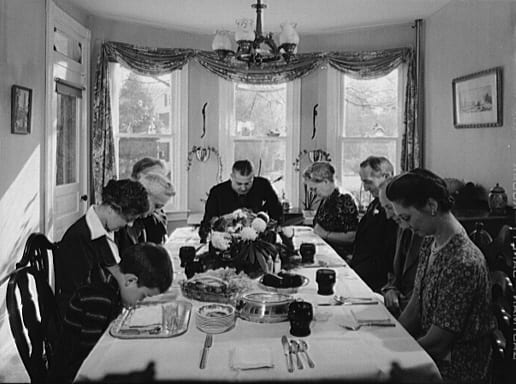 Saying grace before carving the turkey at Thanksgiving dinner in the home of Earle Landis in Neffsville, Pennsylvania, 1942 (Wikimedia Commons)