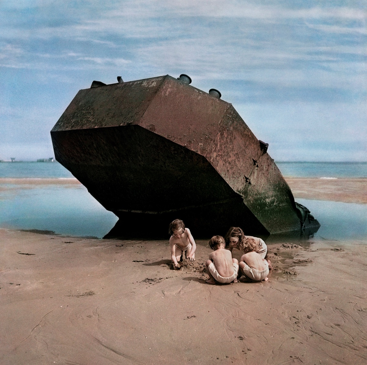 (Children playing among the wreckage of the D-Day invasion. Normandy, France, 1947. © David Seymour (CHIM) Estate/Magnum)